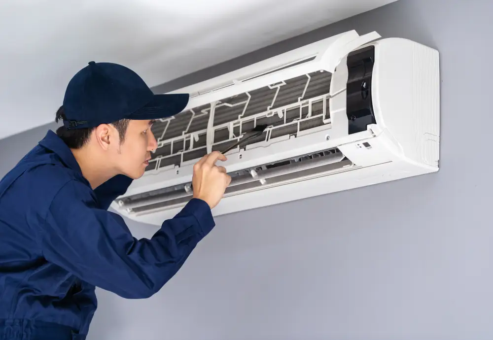AC installation importance for Judsonia homeowners - Man installing a ductless ac unit.