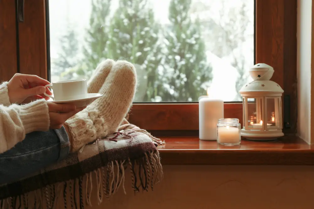 HVAC maintenance plans benefits - Composition of cozy winter day on wooden windowsill